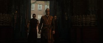 Movie still from “Doctor Strange” (2016), directed by Scott Derrickson – A group of men standing next to each other; Medium shot, Low angle