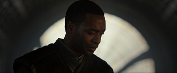 Movie still from “Doctor Strange” (2016), directed by Scott Derrickson – A person with his eyes closed; Close Up shot, Over the shoulder angle