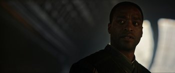 Movie still from “Doctor Strange” (2016), directed by Scott Derrickson – A person wearing a uniform; Close Up shot, Low angle