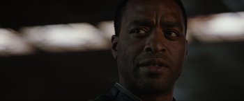 Movie still from “Doctor Strange” (2016), directed by Scott Derrickson – A man's face in the dark; Close Up shot, Over the shoulder angle