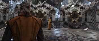 Movie still from “Doctor Strange” (2016), directed by Scott Derrickson – A man standing in front of another man in front of a building; Wide shot, Over the shoulder angle