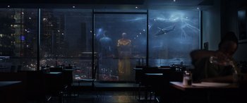 Movie still from “Doctor Strange” (2016), directed by Scott Derrickson – Two people are standing in front of a large window; Extreme Wide shot, Over the shoulder angle