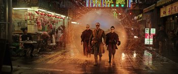 Movie still from “Doctor Strange” (2016), directed by Scott Derrickson – A group of people walking through a tunnel of fire; Wide shot, Low angle