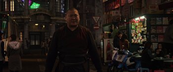Movie still from “Doctor Strange” (2016), directed by Scott Derrickson – A man standing next to a woman in an alley; Medium shot, Over the shoulder angle