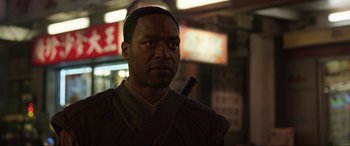 Movie still from “Doctor Strange” (2016), directed by Scott Derrickson – A man with a sword in his mouth; Close Up shot, Over the shoulder angle