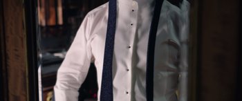 Movie still from “Doctor Strange in the Multiverse of Madness” (2022), directed by Sam Raimi – A man wearing a white shirt and a blue tie; Extreme Close Up shot, High angle