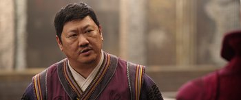 Movie still from “Doctor Strange in the Multiverse of Madness” (2022), directed by Sam Raimi – A man in a purple and red outfit looking at the camera; Close Up shot, Low angle