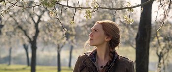 Movie still from “Doctor Strange in the Multiverse of Madness” (2022), directed by Sam Raimi – A woman standing in front of a tree looking up; Close Up shot, Low angle