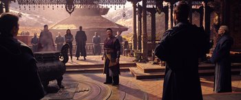 Movie still from “Doctor Strange in the Multiverse of Madness” (2022), directed by Sam Raimi – An image of a man standing in front of a building; Wide shot, High angle