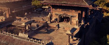 Movie still from “Doctor Strange in the Multiverse of Madness” (2022), directed by Sam Raimi – An aerial view of an old building with a courtyard; Extreme Wide shot, High angle