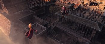 Movie still from “Doctor Strange in the Multiverse of Madness” (2022), directed by Sam Raimi – An aerial view of a man flying through the air while holding an object; Extreme Wide shot, Overhead angle