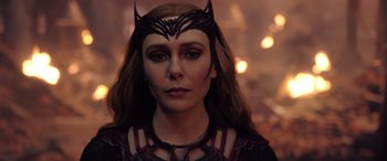 Movie still from “Doctor Strange in the Multiverse of Madness” (2022), directed by Sam Raimi – A person wearing a costume; Close Up shot, Over the shoulder angle