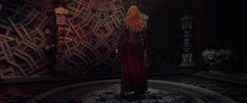Movie still from “Doctor Strange in the Multiverse of Madness” (2022), directed by Sam Raimi – A woman standing in front of a wall; Wide shot, Low angle