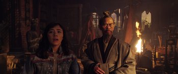 Movie still from “Doctor Strange in the Multiverse of Madness” (2022), directed by Sam Raimi – A man and a woman standing next to each other in a room; Medium shot, Over the shoulder angle