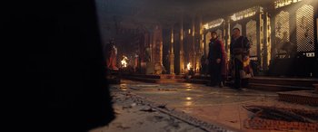 Movie still from “Doctor Strange in the Multiverse of Madness” (2022), directed by Sam Raimi – Two people are standing in front of a pillar; Extreme Wide shot, Low angle