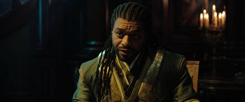 Movie still from “Doctor Strange in the Multiverse of Madness” (2022), directed by Sam Raimi – A person with dreadlocks; Close Up shot, Over the shoulder angle