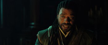 Movie still from “Doctor Strange in the Multiverse of Madness” (2022), directed by Sam Raimi – A person with dreadlocks; Close Up shot, Low angle