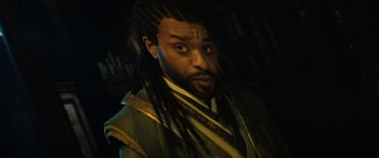 Movie still from “Doctor Strange in the Multiverse of Madness” (2022), directed by Sam Raimi – A person with dreadlocks; Close Up shot, High angle
