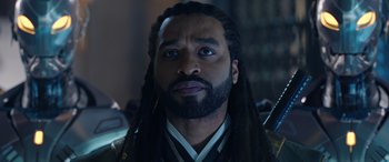 Movie still from “Doctor Strange in the Multiverse of Madness” (2022), directed by Sam Raimi – A person with long dreadlocks; Close Up shot, Over the shoulder angle
