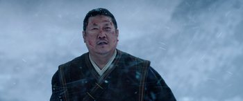 Movie still from “Doctor Strange in the Multiverse of Madness” (2022), directed by Sam Raimi – A man with a bandage on his face; Close Up shot, Low angle