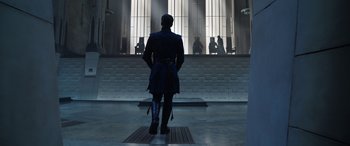 Movie still from “Doctor Strange in the Multiverse of Madness” (2022), directed by Sam Raimi – A man standing in front of a building; Wide shot, Low angle