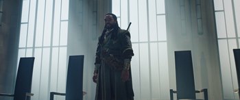 Movie still from “Doctor Strange in the Multiverse of Madness” (2022), directed by Sam Raimi – A man dressed as a pirate standing in front of a window; Medium shot, Over the shoulder angle