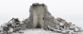 Movie still from “Doctor Strange in the Multiverse of Madness” (2022), directed by Sam Raimi – A door that has been burned in the middle of the day; Wide shot, Low angle