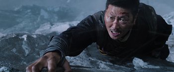 Movie still from “Doctor Strange in the Multiverse of Madness” (2022), directed by Sam Raimi – A man in a black jacket is on the ground; Close Up shot, High angle