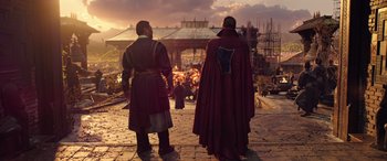 Movie still from “Doctor Strange in the Multiverse of Madness” (2022), directed by Sam Raimi – Two men in medieval garb standing in front of a crowd; Medium shot, Over the shoulder angle