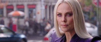 Movie still from “Doctor Strange in the Multiverse of Madness” (2022), directed by Sam Raimi – A person wearing a purple jacket; Close Up shot, Over the shoulder angle