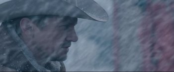 Movie still from “Wind River” (2017), directed by Taylor Sheridan – A person wearing a cowboy hat; Close Up shot, Low angle