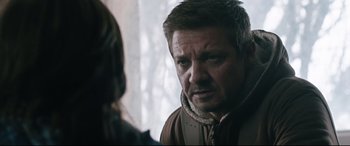 Movie still from “Wind River” (2017), directed by Taylor Sheridan – A man in a brown jacket is looking at a woman; Close Up shot, Over the shoulder angle