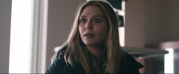 Movie still from “Wind River” (2017), directed by Taylor Sheridan – A person with long blonde hair; Close Up shot, Over the shoulder angle