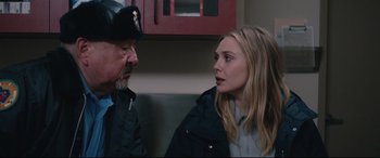Movie still from “Wind River” (2017), directed by Taylor Sheridan – A man and a woman talking to each other; Close Up shot, Over the shoulder angle