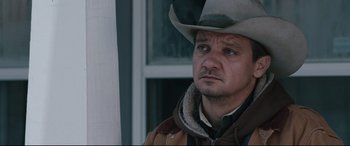 Movie still from “Wind River” (2017), directed by Taylor Sheridan – A person wearing a cowboy hat; Close Up shot, Over the shoulder angle
