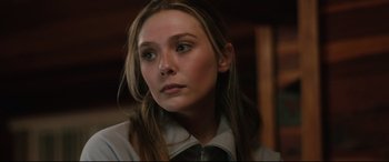 Movie still from “Wind River” (2017), directed by Taylor Sheridan – A person with long brown hair; Close Up shot, Low angle