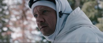 Movie still from “Wind River” (2017), directed by Taylor Sheridan – A person wearing a jacket and a hat; Close Up shot, Over the shoulder angle