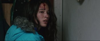 Movie still from “Wind River” (2017), directed by Taylor Sheridan – A young woman with blood all over her face; Close Up shot, Over the shoulder angle