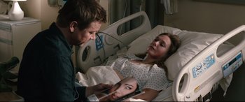 Movie still from “Wind River” (2017), directed by Taylor Sheridan – A man and a woman in a hospital bed looking at each other; Close Up shot, Over the shoulder angle