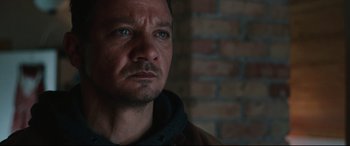 Movie still from “Wind River” (2017), directed by Taylor Sheridan – A person looking at the camera; Close Up shot, Low angle