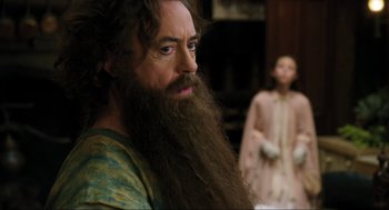 Movie still from “Dolittle” (2020), directed by Stephen Gaghan – A man with a long beard is looking at the camera; Close Up shot, Over the shoulder angle