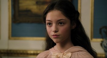 Movie still from “Dolittle” (2020), directed by Stephen Gaghan – A young girl with long hair and a pink dress; Close Up shot, High angle