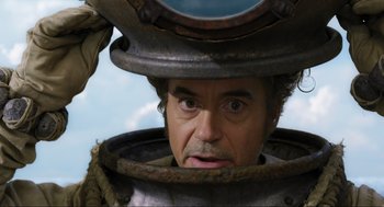 Movie still from “Dolittle” (2020), directed by Stephen Gaghan – A person with a helmet on; Close Up shot, Low angle