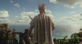 Movie still from “Dolittle” (2020), directed by Stephen Gaghan – A statue of a man with a crown on his head; Extreme Wide shot, Low angle
