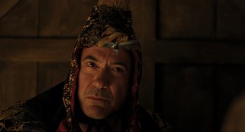 Movie still from “Dolittle” (2020), directed by Stephen Gaghan – A person wearing a hat; Close Up shot, Over the shoulder angle