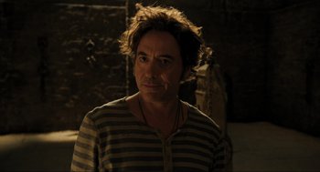 Movie still from “Dolittle” (2020), directed by Stephen Gaghan – A person wearing a striped shirt; Close Up shot, Over the shoulder angle