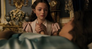Movie still from “Dolittle” (2020), directed by Stephen Gaghan – A young girl holding her hands to her chest; Close Up shot, Over the shoulder angle