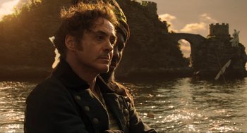 Movie still from “Dolittle” (2020), directed by Stephen Gaghan – A man and a woman are standing in the water; Close Up shot, Over the shoulder angle