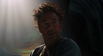 Movie still from “Dolittle” (2020), directed by Stephen Gaghan – A person with curly brown hair; Close Up shot, Over the shoulder angle