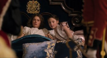 Movie still from “Dolittle” (2020), directed by Stephen Gaghan – Two young girls are sitting on a bed; Medium shot, High angle